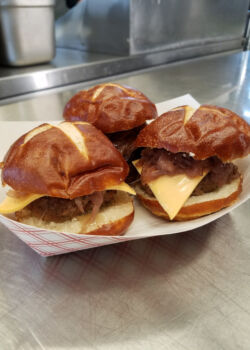 Baby burger sliders with American cheese and carmelized onions